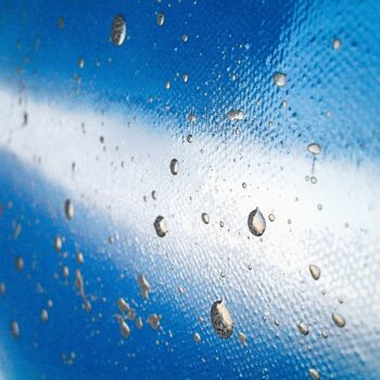 Art collection canvas blue base, white spray paint and silver dripping by painter Davide Canepa.