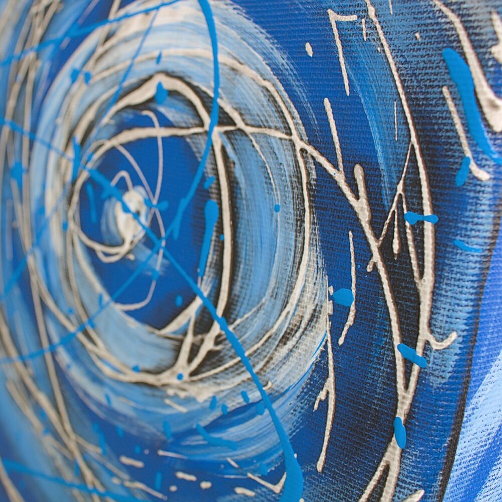Drip paint white and light blue on blue canvas by Davide Canepa.